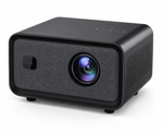 A modern black portable projector with a textured fabric front grille, a large central lens, and a small side sensor, shown on a clean white background.